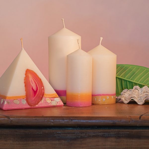 Our Frangipani and Ylang Ylang nest includes one 90 hour pyramid and three pillar candles (40 hour, 90 hour and 140 hour) a combined burn time over 360 hours. As your pyramid burns, the flame illuminates the Agate crystal, revealing the stone's unique variegated patterns and leaving you with a gorgeous keepsake. The base of all these candles are embedded with river pebbles. Essential oils of Frangipani and Ylang Ylang create a sweet and playful scent , heady yet invoking a light hearted overtone.
