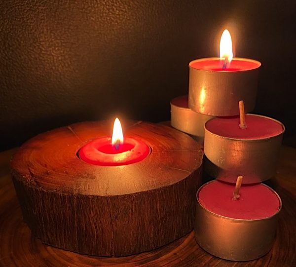 Each scented tea-light cup burns brightly for eight hours.