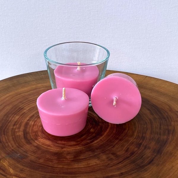 Three Rose & Geranium pure soy Votive candles, with one glass, burn brightly for a total of 24 hours with an exquisitely divine perfume.