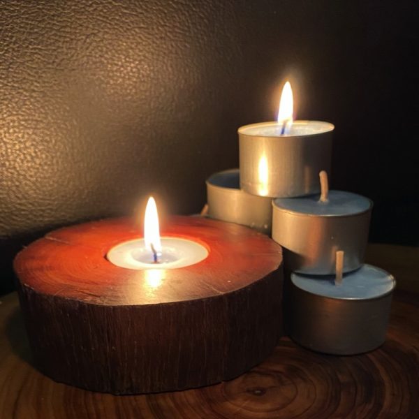 Each scented tea-light cup burns brightly for eight hours.