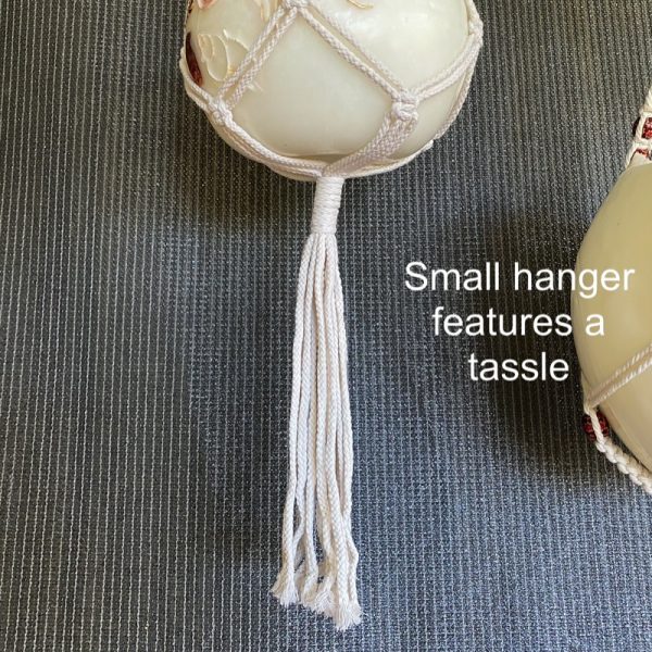 The small lantern hanger features a long tassle.