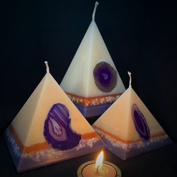 Our Lavender and Vanilla nest of pyramids combined burn time is over 440 hours. As your pyramid candle burns, the flame illuminates the Agate, revealing the stone's unique variegated patterns, and leaves you with a gorgeous keepsake. Essential oils of lavender and vanilla make this light cream coloured candle a favourite. The lilac base, separated by a warm autumn tone of colour, both embedded with soft pastel river pebbles and agate crystal.
