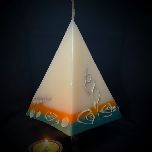 Cleopatra: largest in our pyramid range burning over 190 hours. Take me to the beach please! Fresh, warm and tropically scented this range is infused with essential oils of lime and coconut. White in colour, these candles feature an sunburnt orange and teal banded base embedded with sea shells. As you near the end of your candle's burning, the trove of exotic shells is revealed - your lasting keepsake.