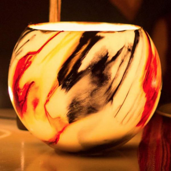 When lit, the Orange and Black lantern suggests a bush campfire. Photo Integrity Candles