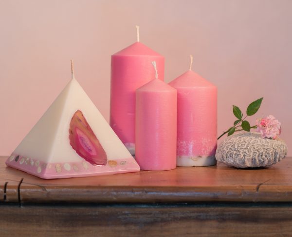 Our Rose and Geranium candle nest includes one 90 hour pyramid and three pillar candles (40 hour, 90 hour and 140 hour) a combined burn time over 360 hours. As your pyramid burns, the flame illuminates the Agate crystal, revealing the stone's unique variegated patterns and leaving you with a gorgeous keepsake. The base of the pillar candles are embedded with river pebbles. Essential oils of Rose and Geranium oils create a luxurious scent with fresh and relaxing overtones.