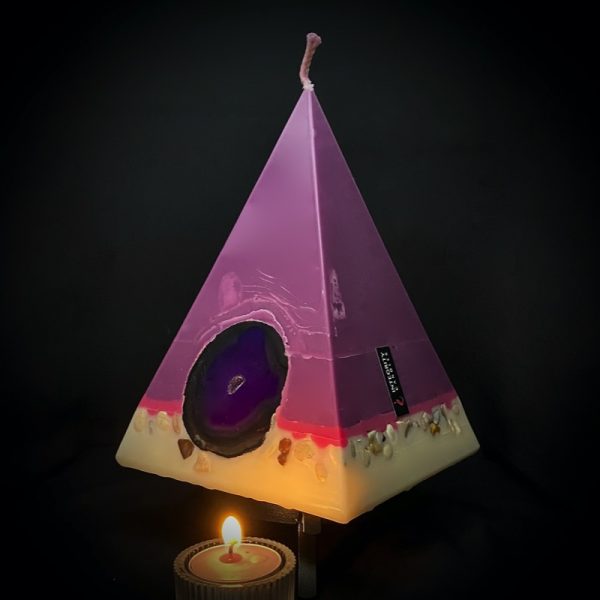Cleopatra: largest in our pyramid range burning over 190 hours. Deeply relaxing, essential oils of Lavender, Patchouli, Citrus, Marjoram, Jojoba, Geranium and Chamomile are presented in a meditative shade of purple. A band of magenta sits above a white base embedded with agate slices and river pebble. As your pyramid candles burn, the flame illuminates the Agate, revealing the stone's unique variegated patterns, and leaves you with gorgeous keepsakes.