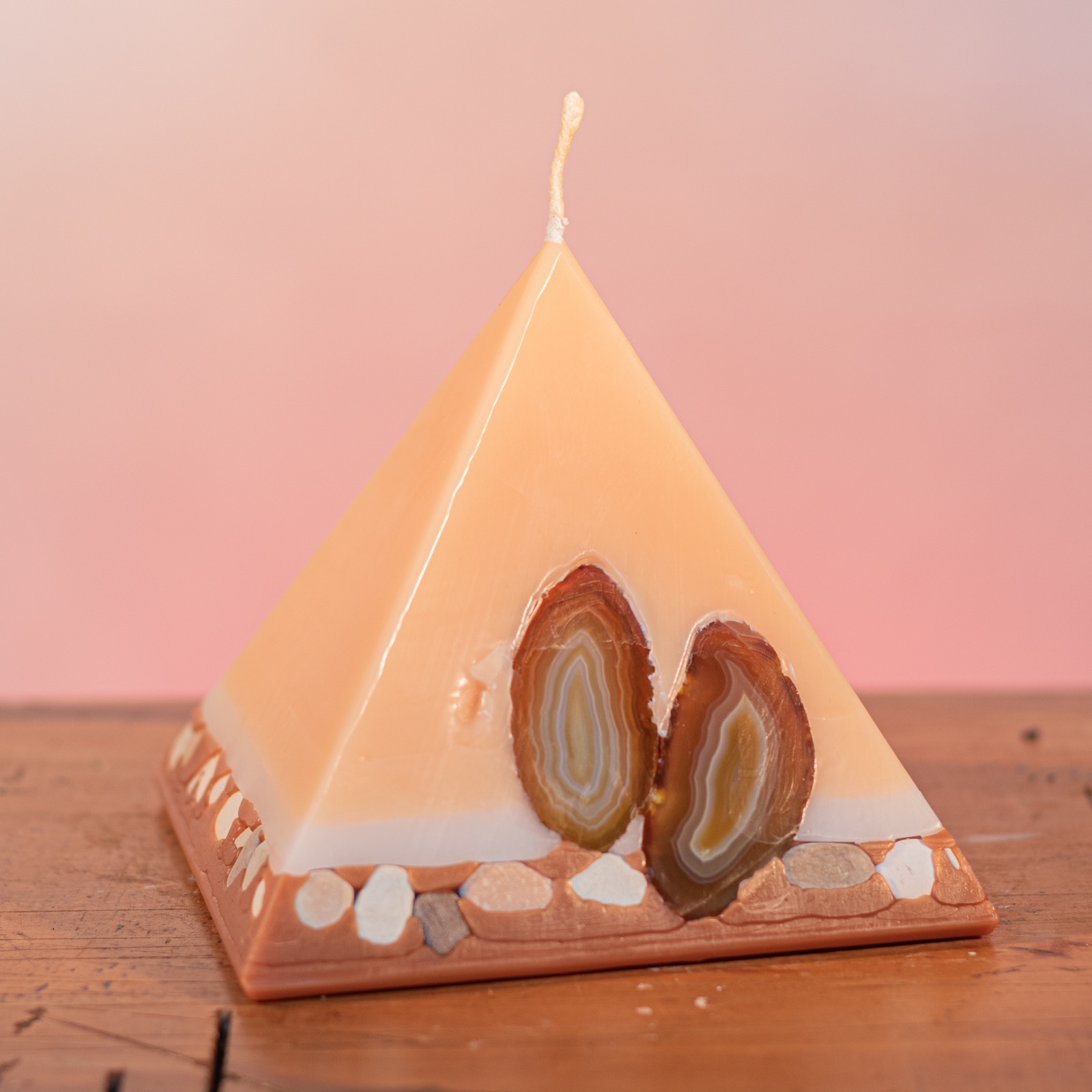 As your pyramid candle burns, the flame illuminates the Agate, revealing the stone's unique variegated patterns, and leaves you with a gorgeous keepsake. As your pyramid candle burns, the flame illuminates the Agate, revealing the stone's unique variegated patterns, and leaves you with a gorgeous keepsake.