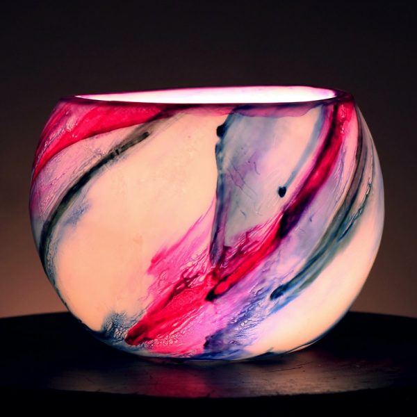 The candle's glow changes the story of Pink and Blue. Photo by Integrity Candles