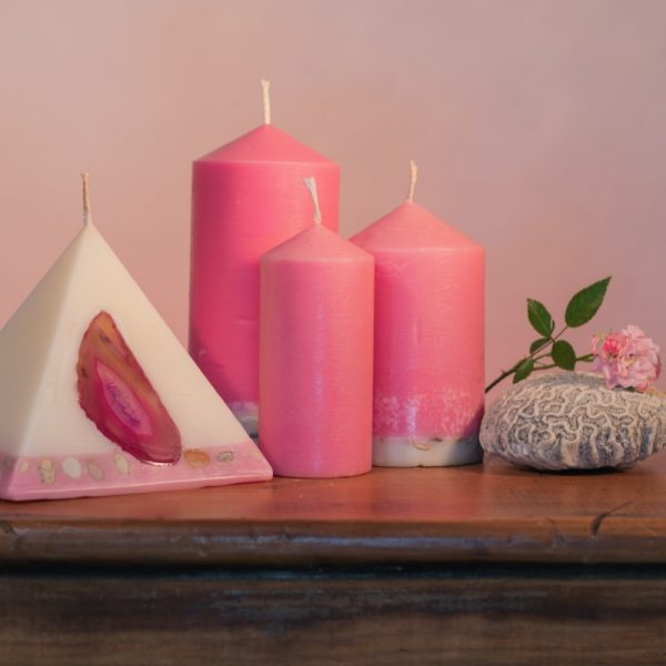Our Rose and Geranium candle nest includes one 90 hour pyramid and three pillar candles (40 hour, 90 hour and 140 hour) a combined burn time over 360 hours. As your pyramid burns, the flame illuminates the Agate crystal, revealing the stone's unique variegated patterns and leaving you with a gorgeous keepsake. The base of the pillar candles are embedded with river pebbles. Essential oils of Rose and Geranium oils create a luxurious scent with fresh and relaxing overtones.