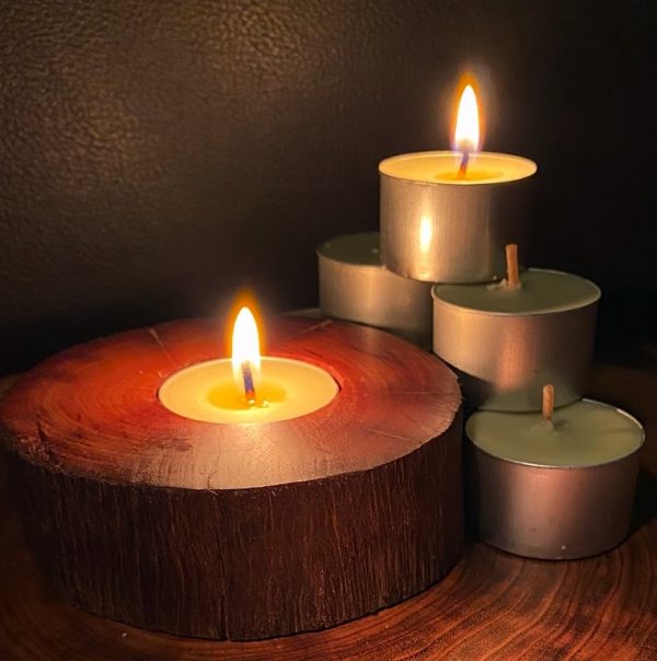 Each scented tea-light cup burns brightly for eight hours.