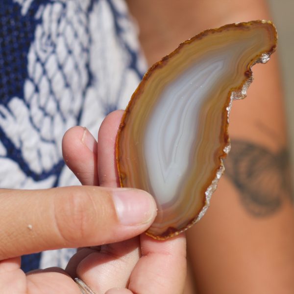 An Agate Crystal slice is embedded into one face of the Pyramid Candle.