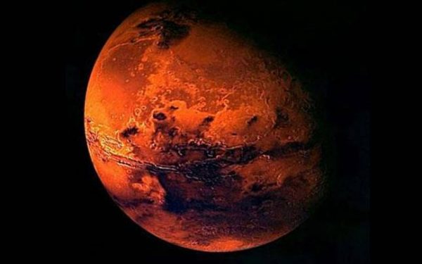 Mars is the fourth planet from the Sun and is the second smallest in the solar system. It is named after the Roman god of war. The Mars symbol (♂) is a depiction of a circle with an arrow emerging from it, pointing at an angle to the upper right. It is also the old and obsolete symbol for iron in alchemy. In biology and botany, it is used to represent the male sex (alongside the astrological symbol for Venus representing the female sex), following a convention introduced by Linnaeus in the 1750s. Photo: NASA via Wikipedia
