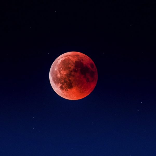 Blood Moon. After 1 hour of hiking, we set up our cameras at 2500m. Although we had expected to see the moon rise right above the mountains, clouds on the horizon delayed when we got our first glimpse of red light. This was my first lunar eclipse photography session and I am afraid I may have been too enthusiastic about the photography. Next time, I’ll focus more on the actual experience. Until then, the result of 90 stacked RAW files taken at around 23h35 CET will have to suffice! Note the faint stars from the original stacked file that show that even at high ISO, modern CMOS sensors have great DR! Photo by Martin Adams on Unsplash